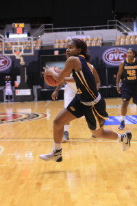 Jenny Rohl // The News Sophomore guard Jasmine Borders drives to the basket in Wednesday's game.