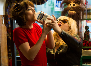 Photo courtesy of www.warnerbros.co.uk Dakota Johnson (left) and Rebel Wilson (right) party as single women in the new comedy “How to Be Single.”