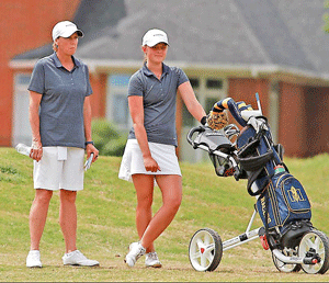 Photo Courtesy Dave Winder-Murray State Athletics Folke, the individual OVC Tournament champion, stands next to Head Coach Velvet Milkman as she strategizes her next shot on the second day.