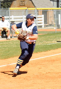 Nicole Ely/The News Freshman utility player Brenna Finck throws the ball to first base during Sunday’s loss against Eastern Illinois. 