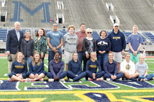 McKenna Dosier/The News Track and field seniors take the field to be honored alongside family, friends, professors and advisers during the Margaret Simmons Invitational on Saturday. The Racers graduate 12 women from the team. 